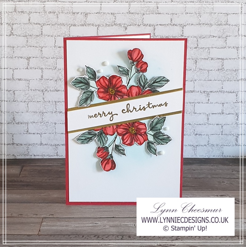Simple and elegant Christmas card with floral image cut from patterned paper and gold heat embossed sentiment