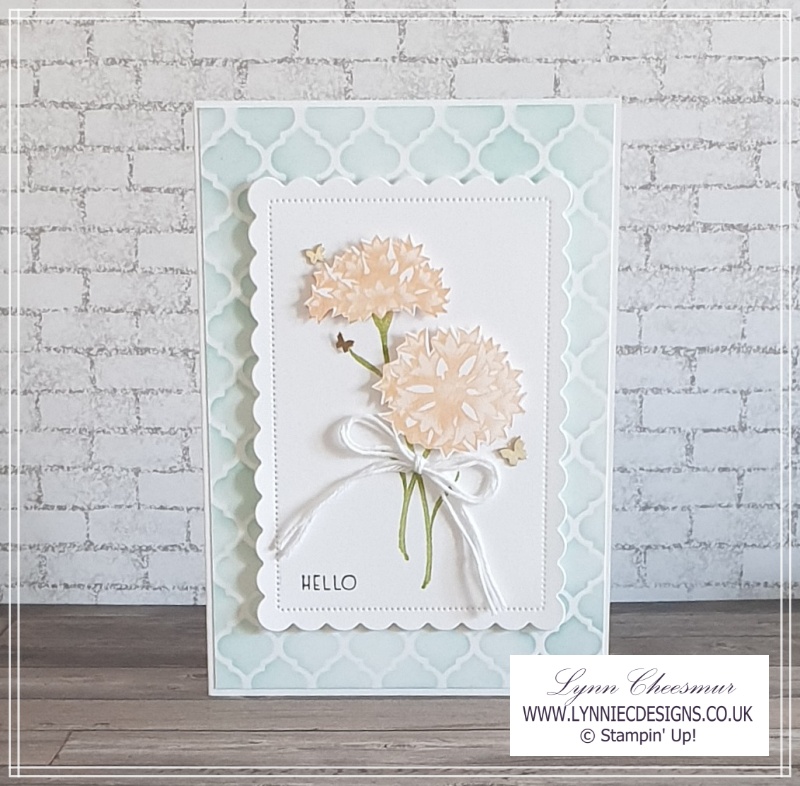 Greeting card with a decorative masks background and floral topper